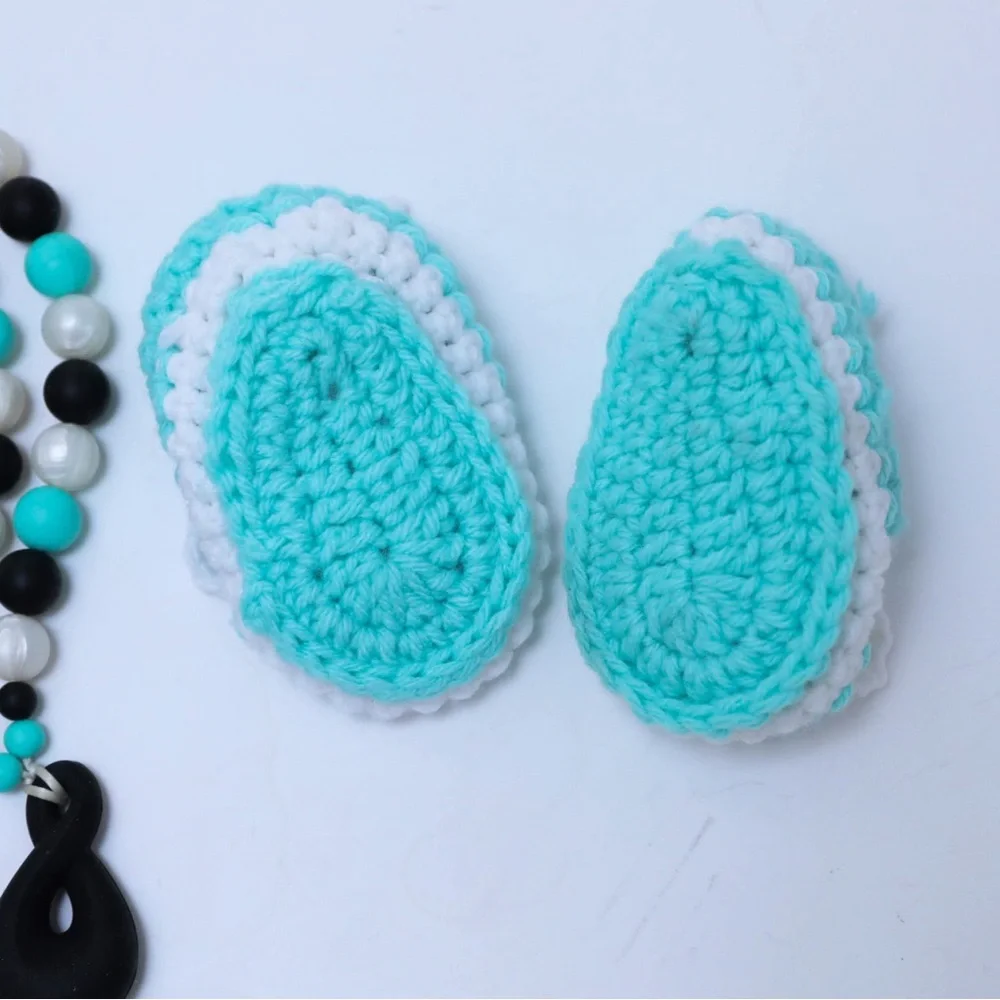 Set of crocheted baby shoes and teal baby teething necklace chewy shower newborn